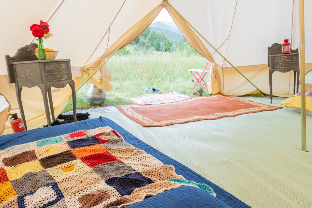blueberry glamping tent interior bed and rugs